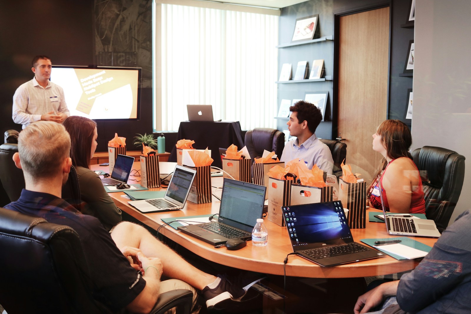 A Finance AI Push facilitator leading a flow board session at the Marina One studio